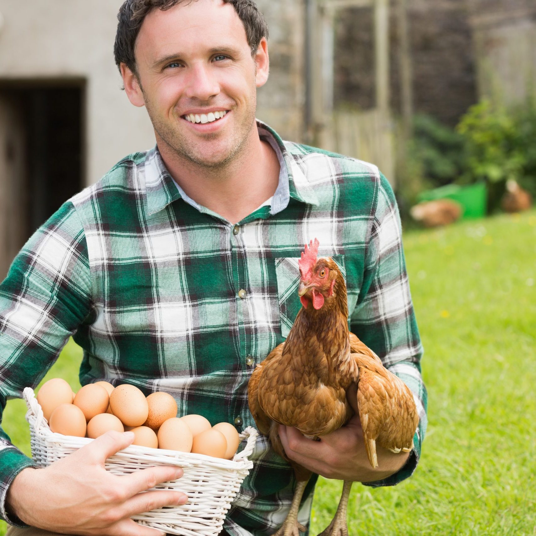 happy-young-man-holding-his-chicken-basket-eggs